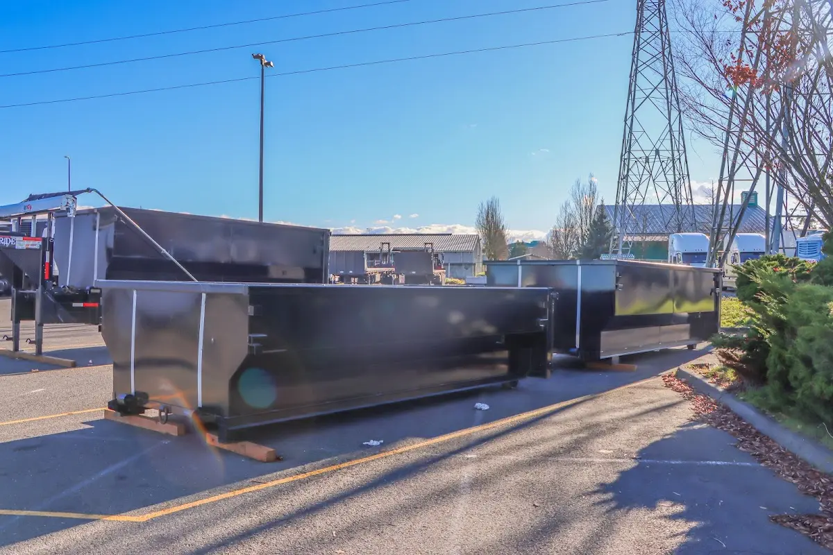 Roll-off dumpster ready for waste disposal at job site for Demolition Dumpster Rental in Kingsland
